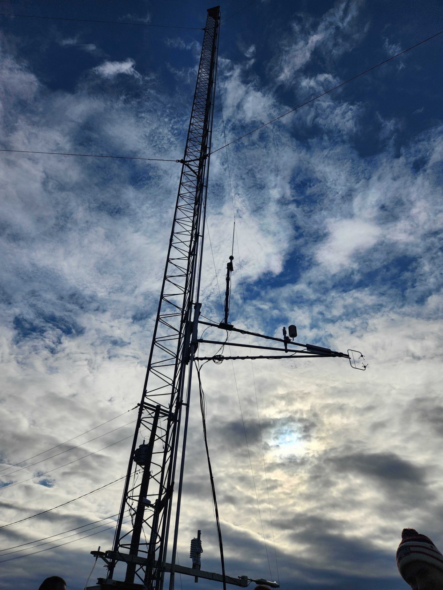 The top sonic arm being winched down for inlet installation