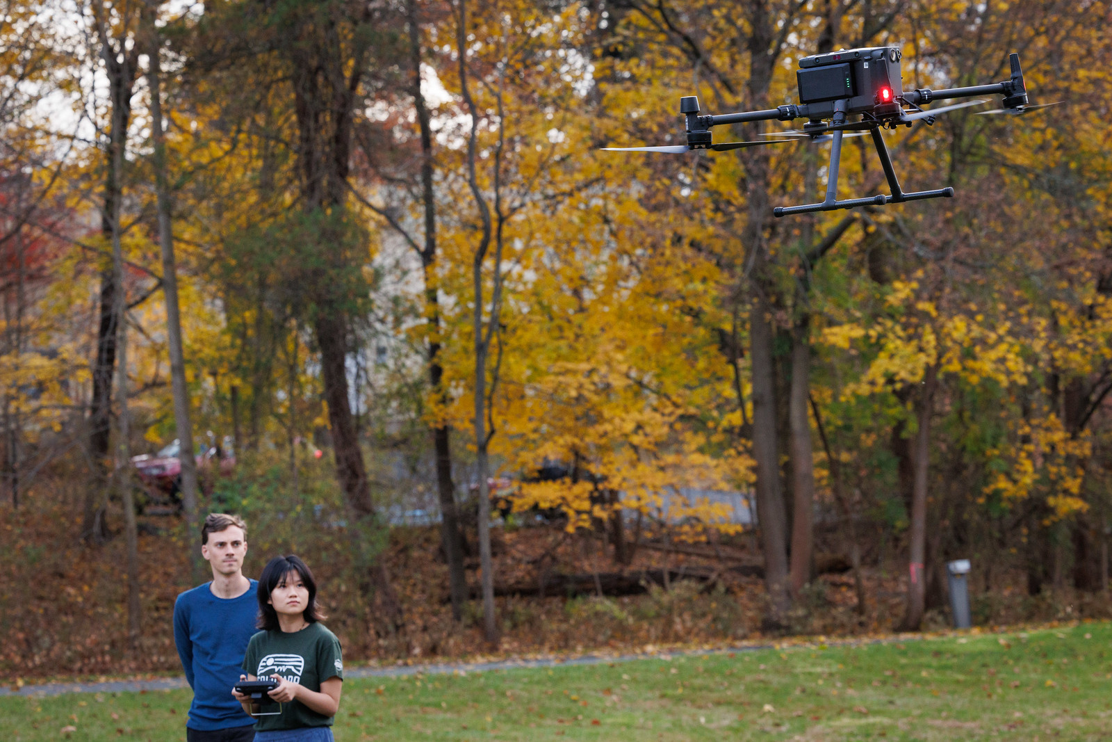 Andrew and Yuwei measure methane using sensors on a drone. Andrew and Yuwei measure methane using sensors on a drone.